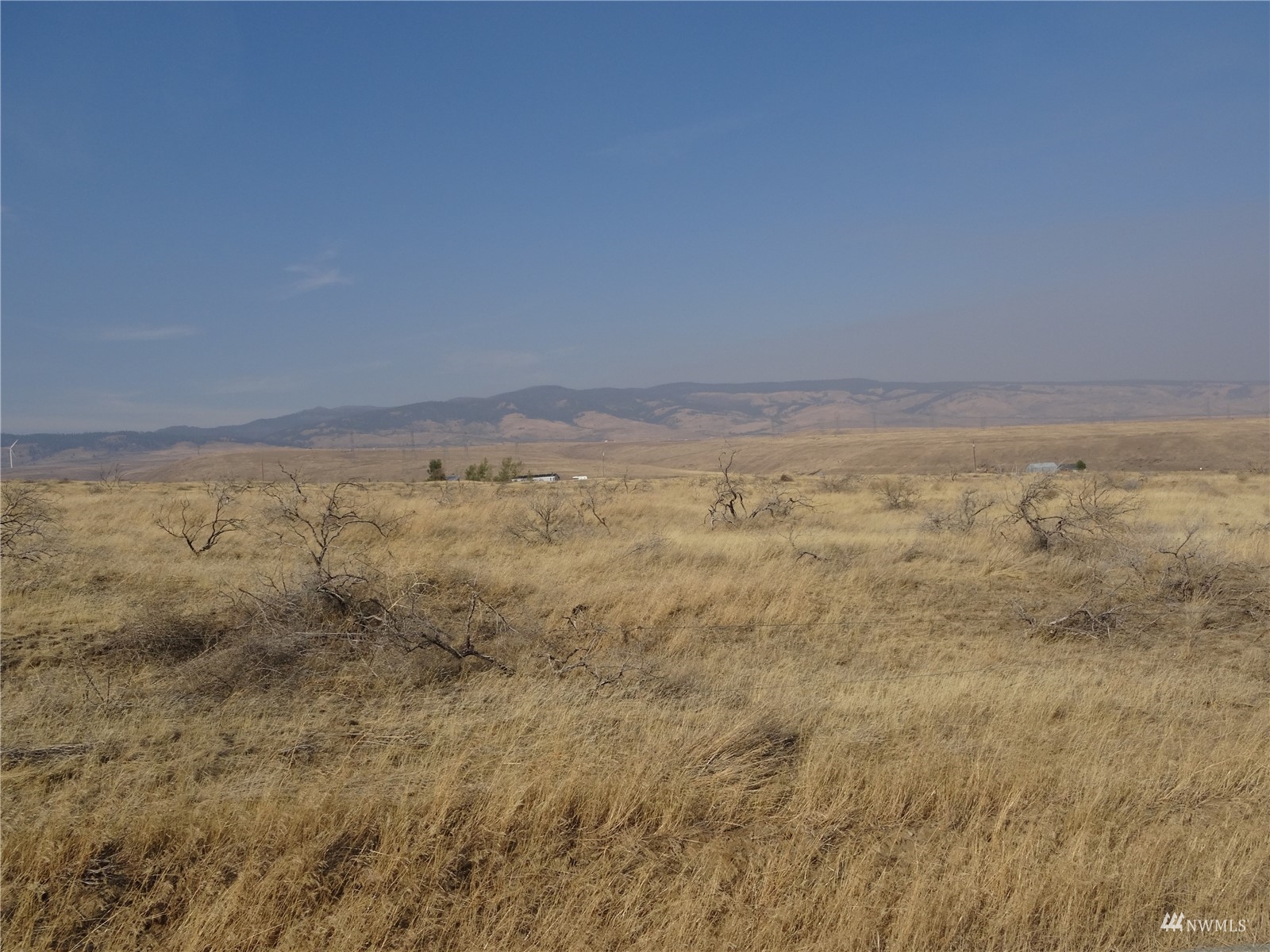 a view of a room with an empty space and a window