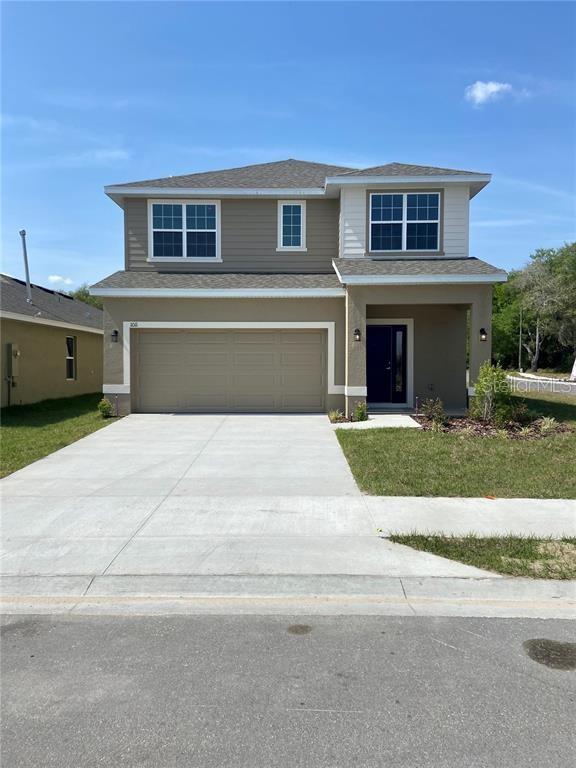 a front view of a house with yard