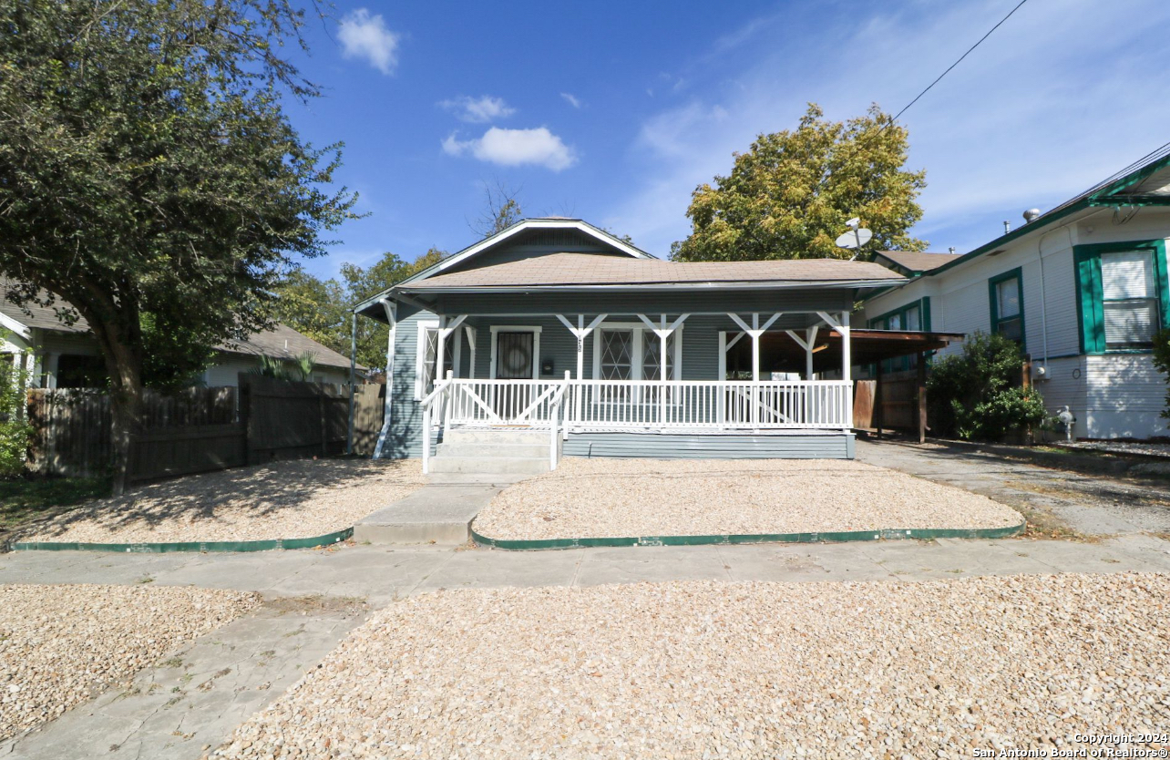 a house with trees in the background