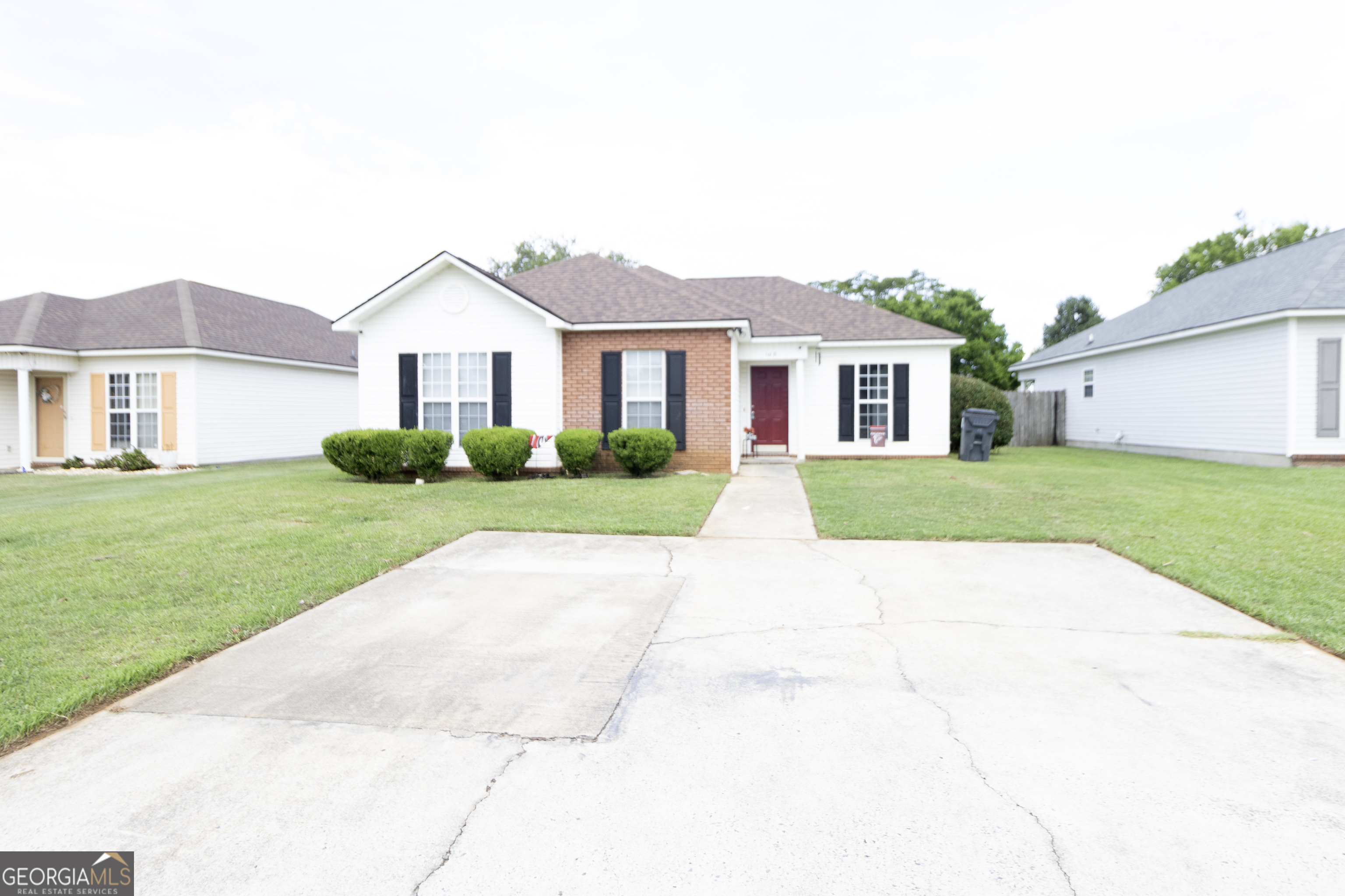 a view of house with a yard