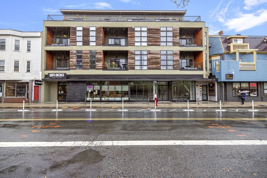 a view of a building with a street