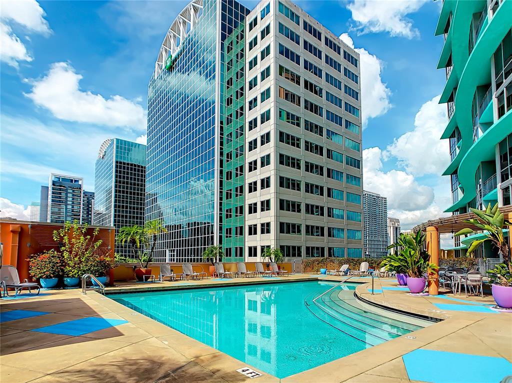 a view of a swimming pool with a lounge chairs