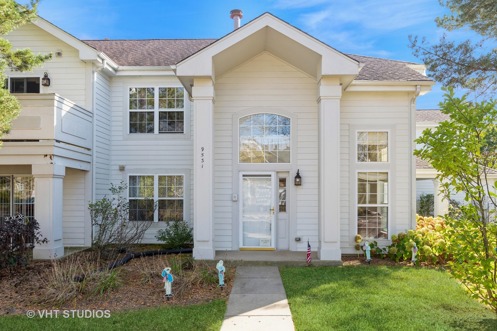 a front view of a house with a yard