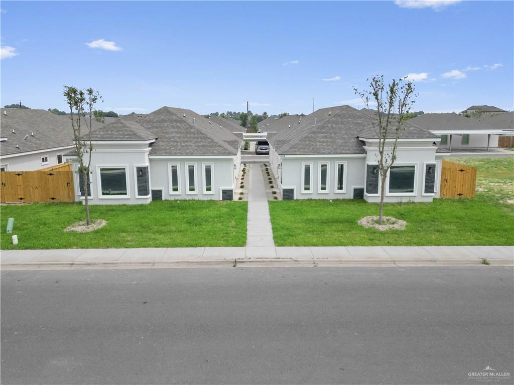 Ranch-style house featuring a front lawn