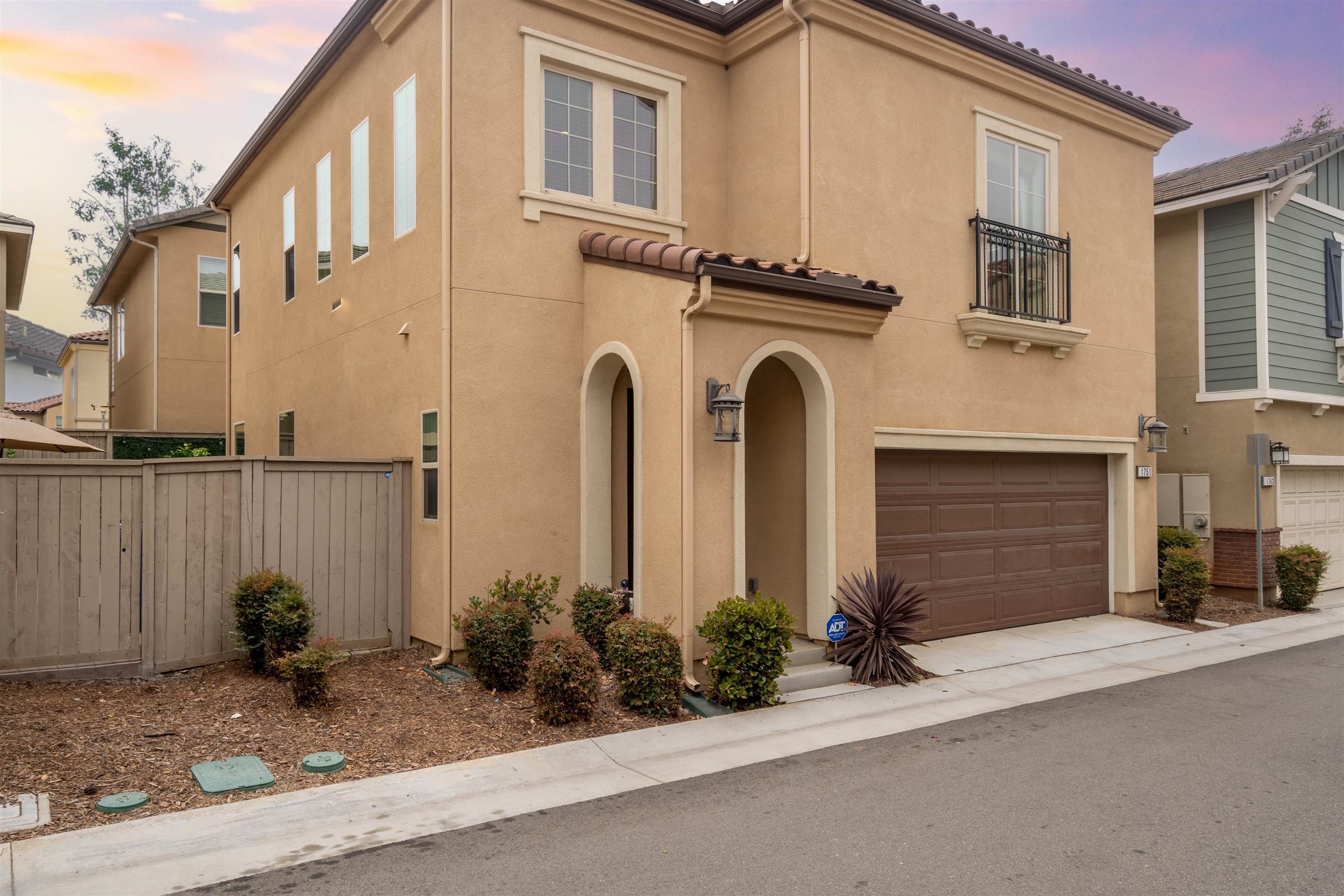 a view of a house with a yard and garage