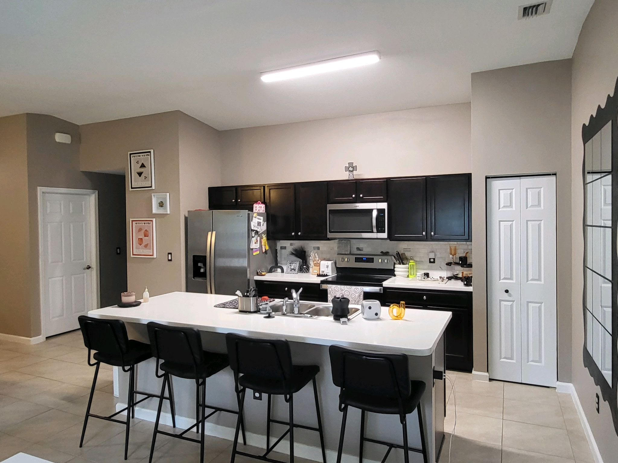 a kitchen with a dining table and chairs