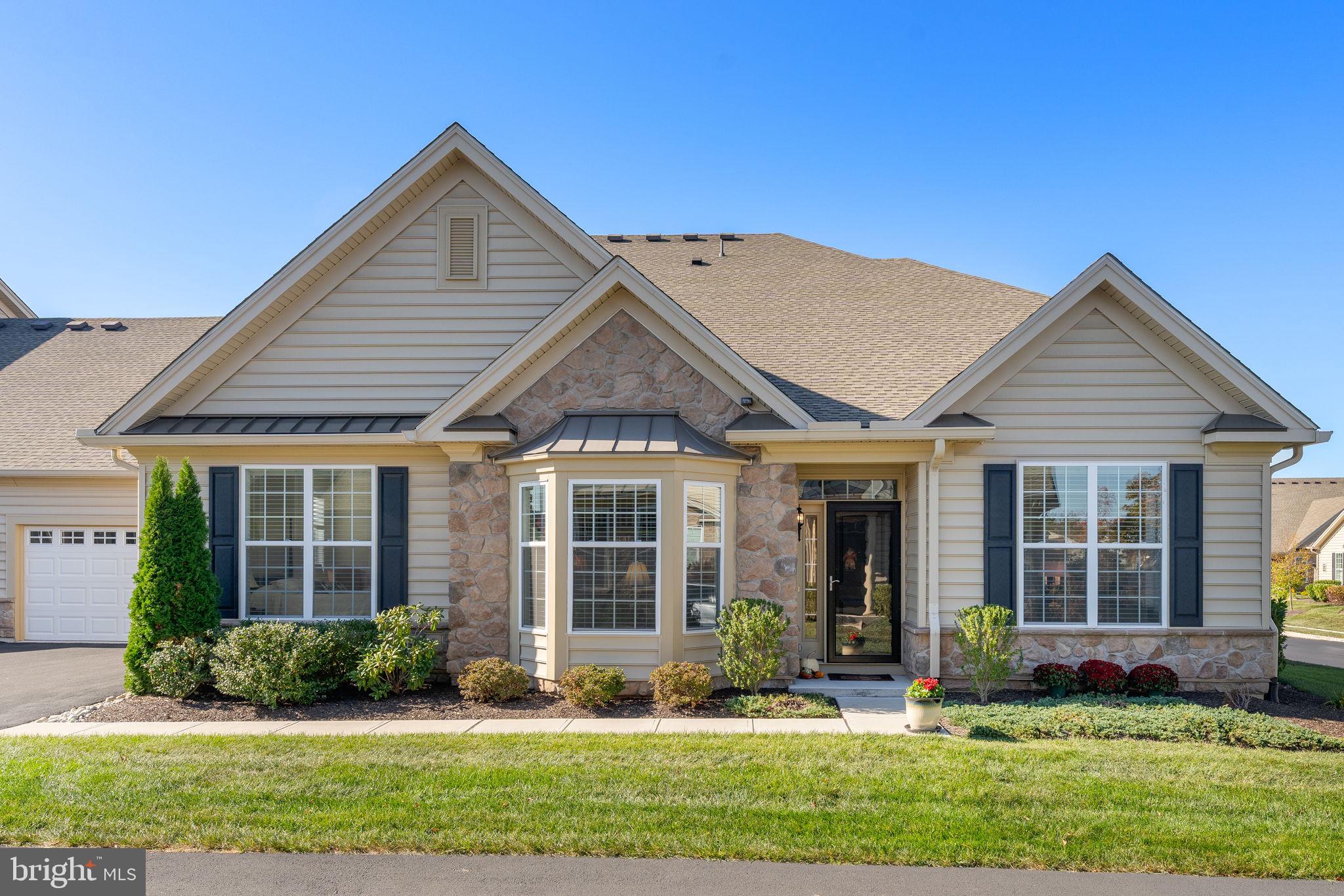 front view of a house and a yard