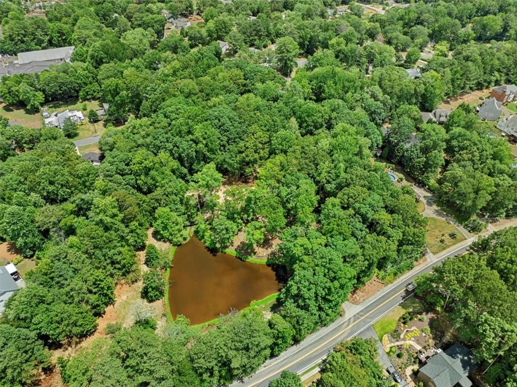 an aerial view of a house with yard