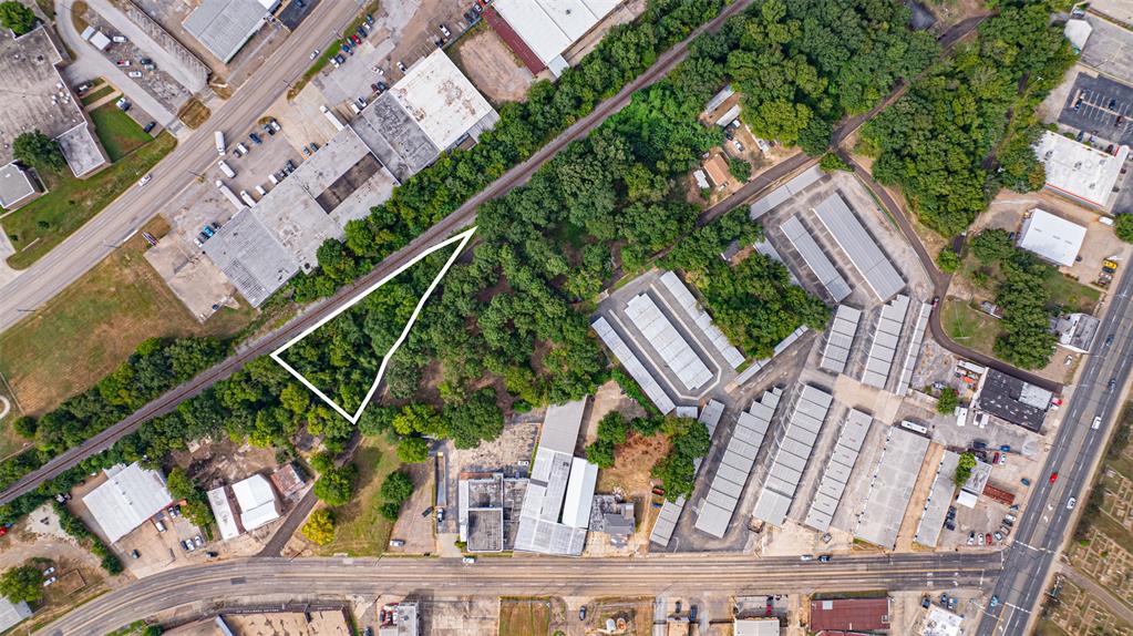 an aerial view of a house with outdoor space