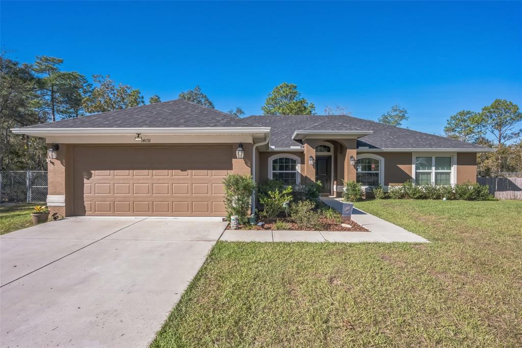 front view of a house with a yard