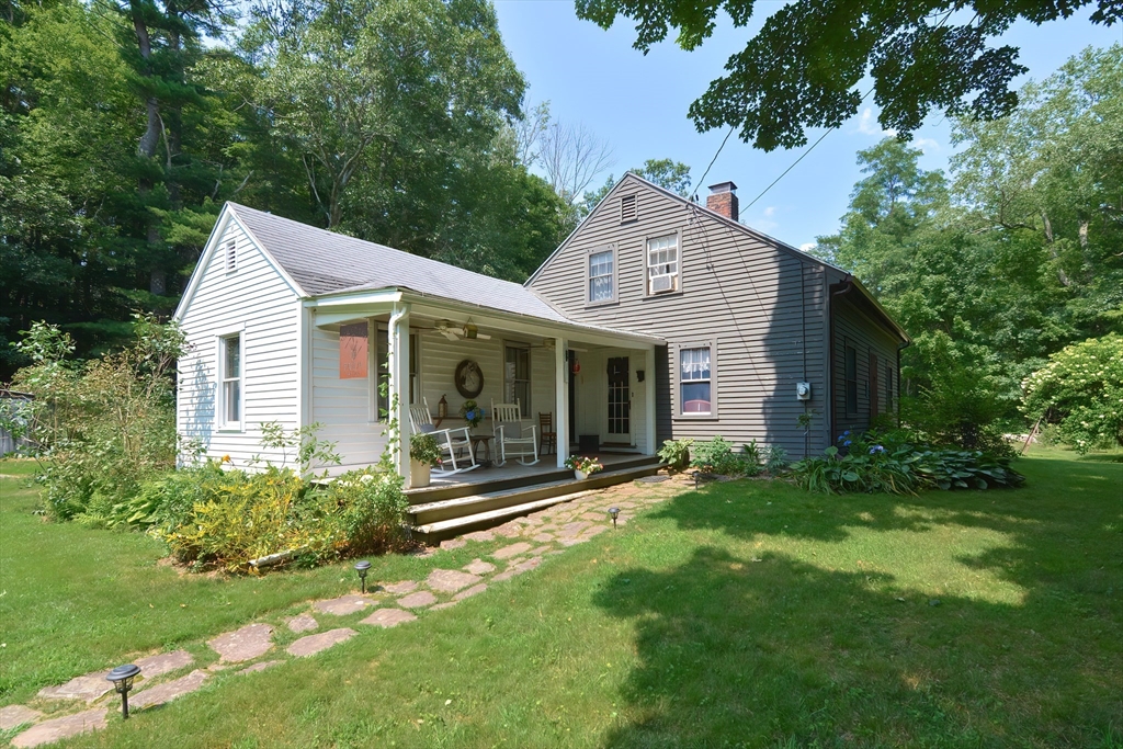 a view of a house with a yard