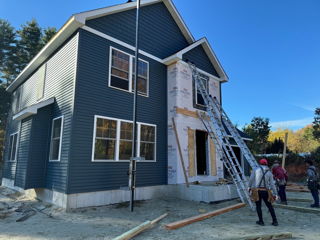 a front view of a house with stairs