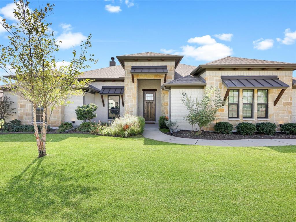 a front view of a house with garden