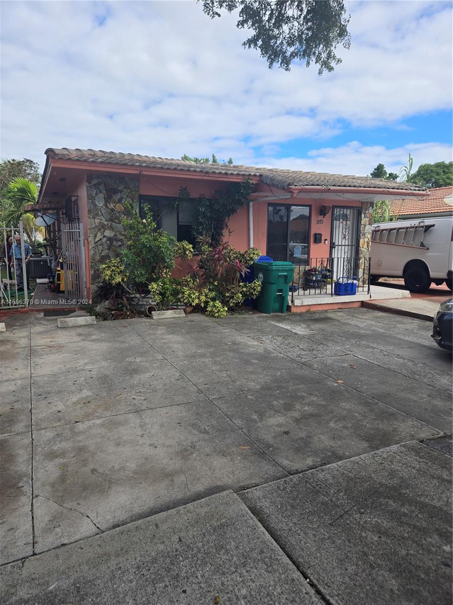 a view of house with outdoor space and porch