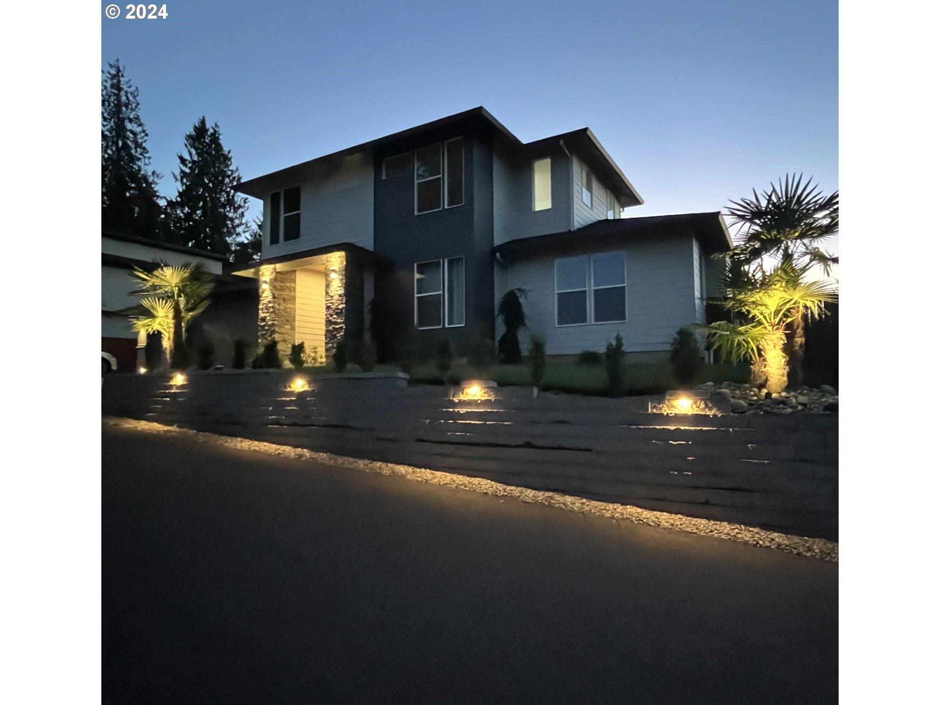 a front view of a house with yard