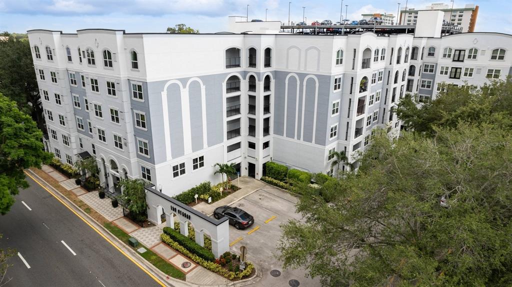 a view of building with yard and staircase