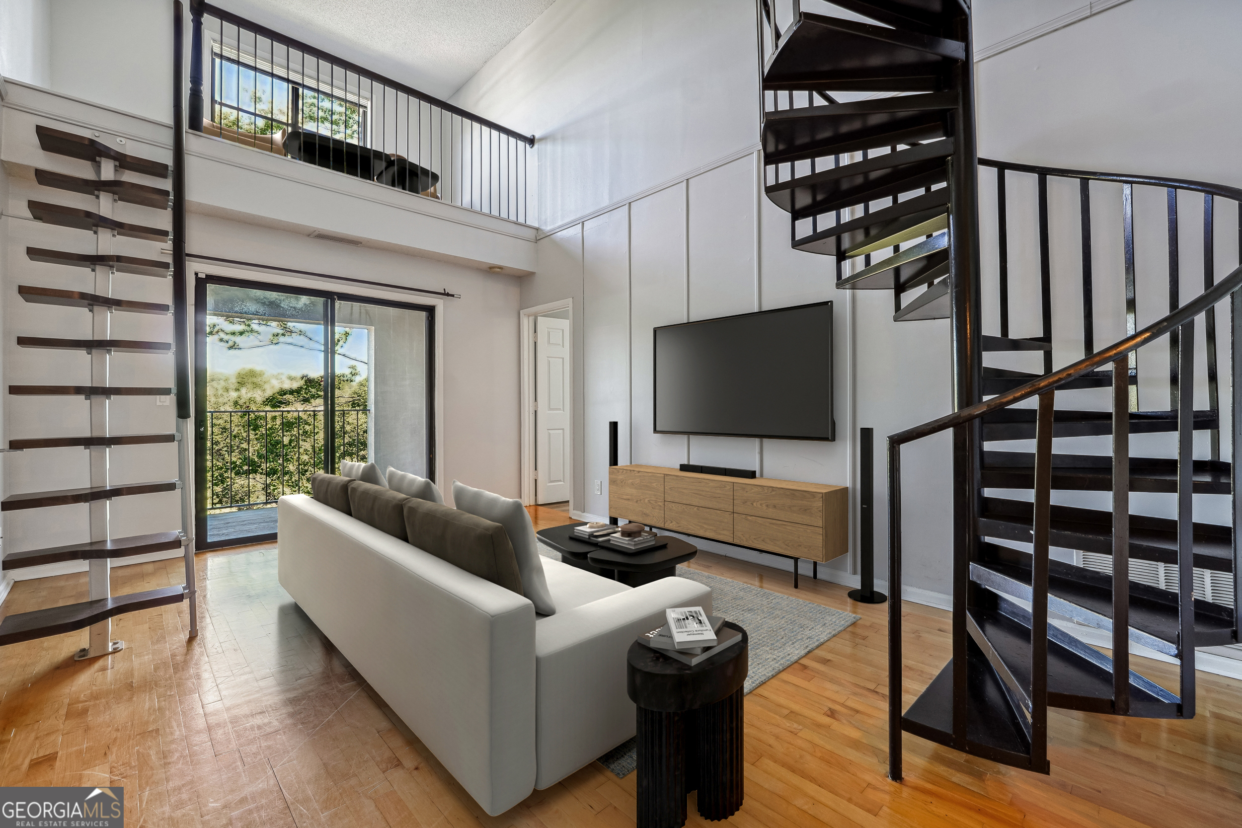 a living room with furniture and a flat screen tv