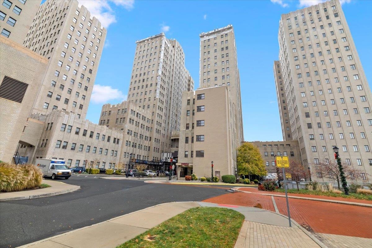 a city street with tall buildings and a street