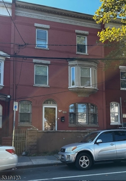 a front view of a house with parking