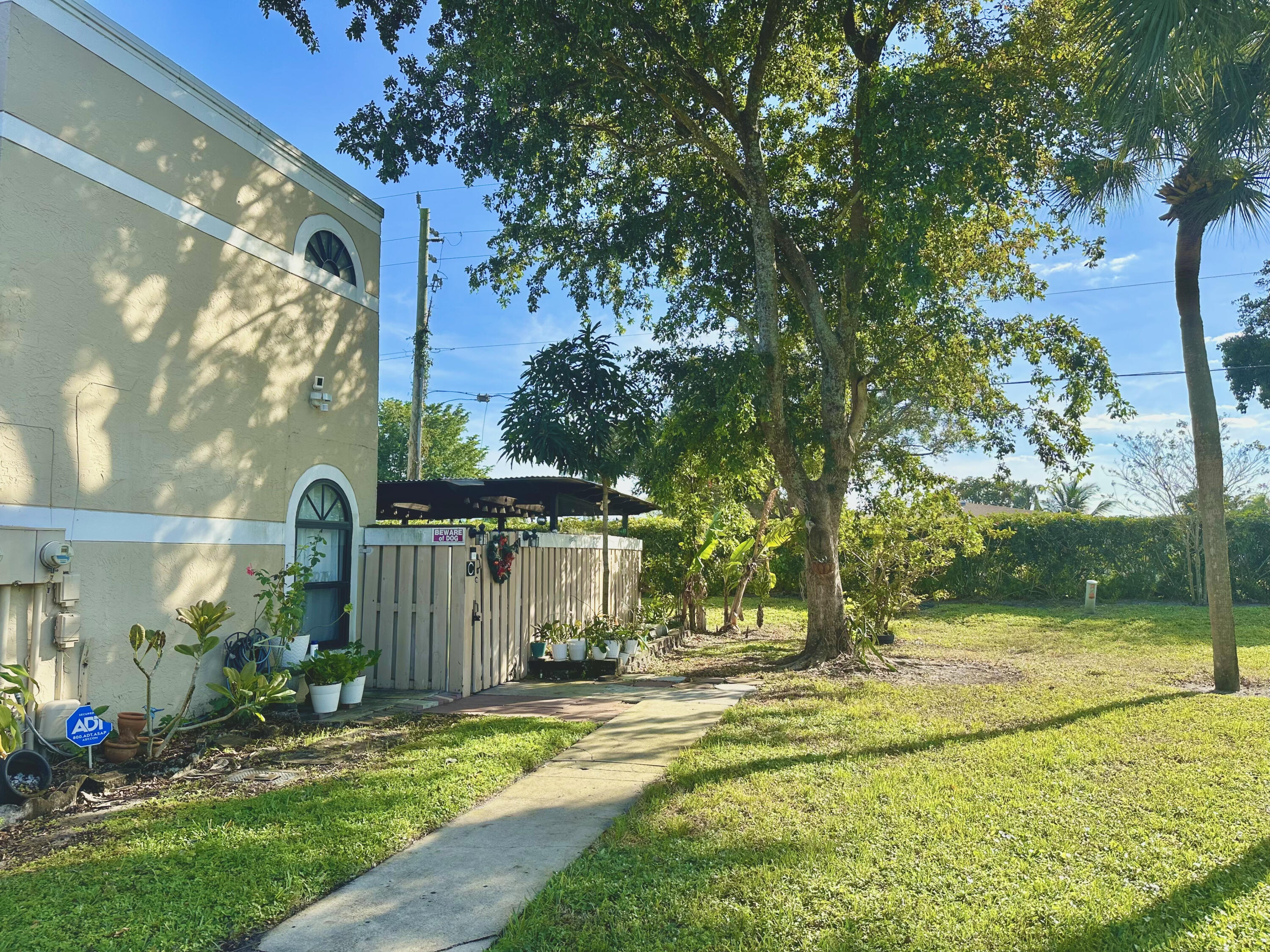 a view of a house with a yard and tree s