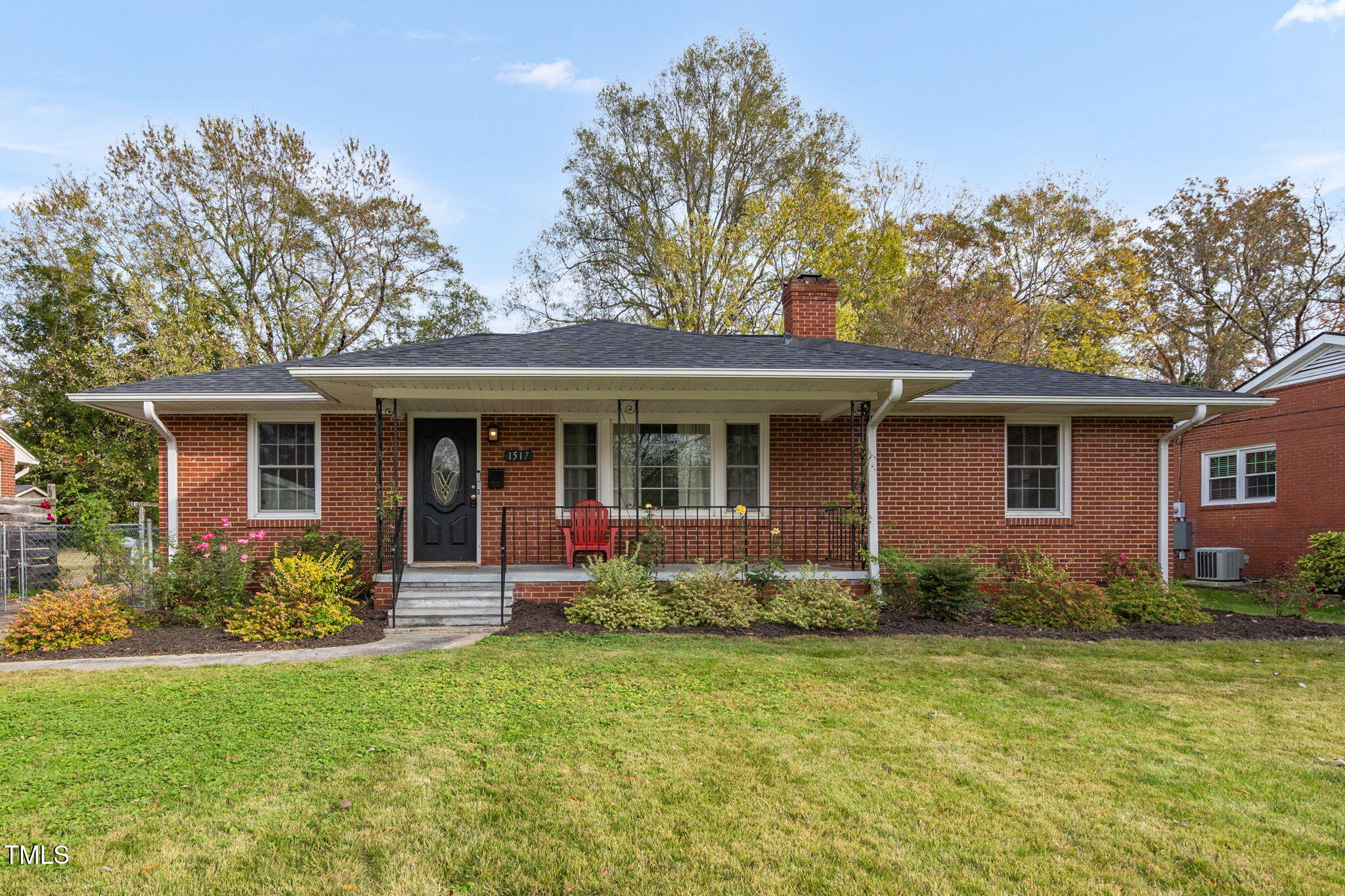 a front view of house with yard and outdoor seating