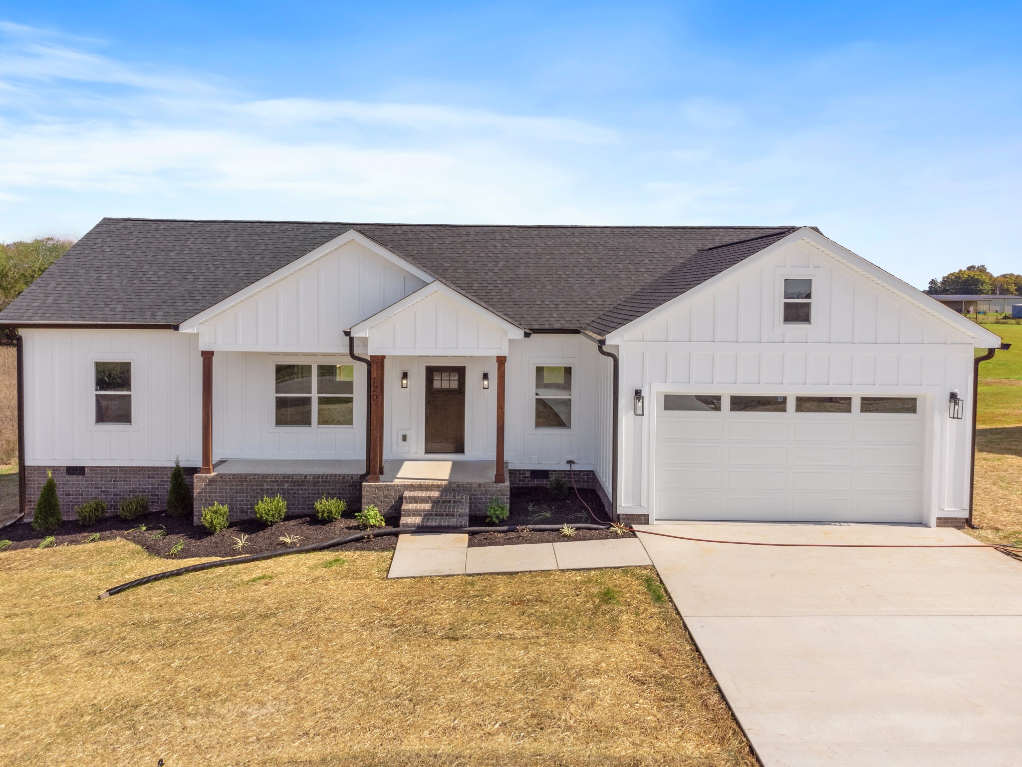 a front view of a house with a yard