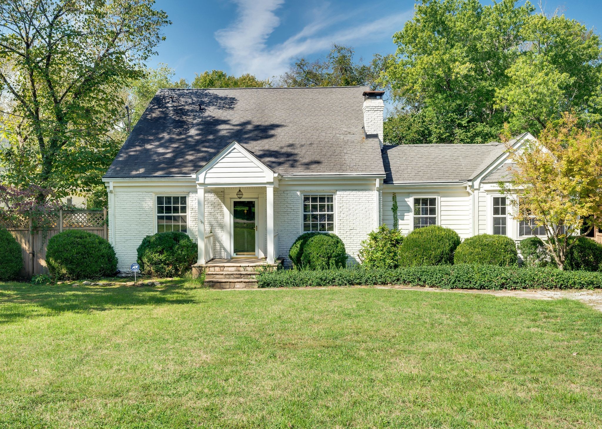 front view of a house with a yard