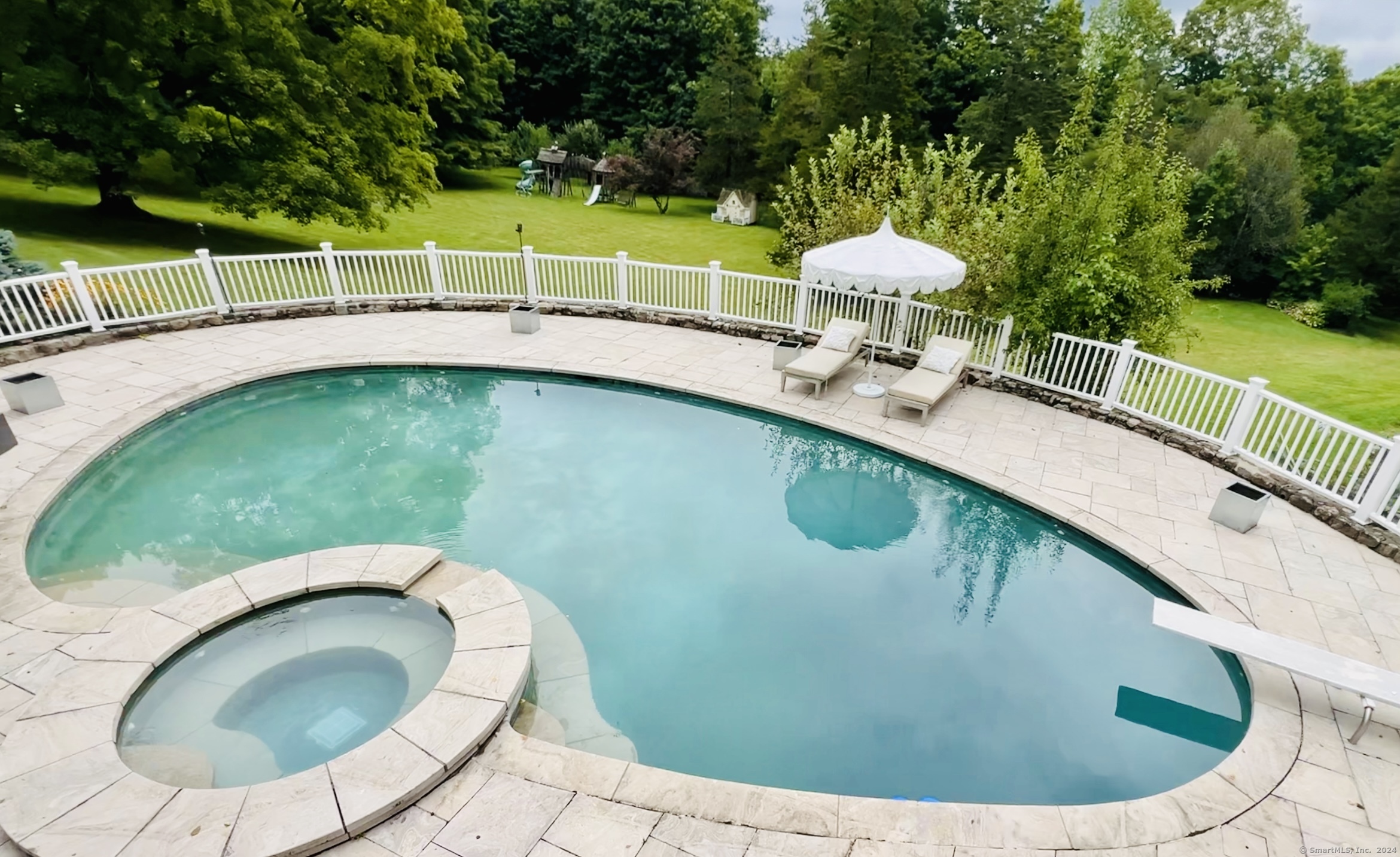 a view of a swimming pool with a yard