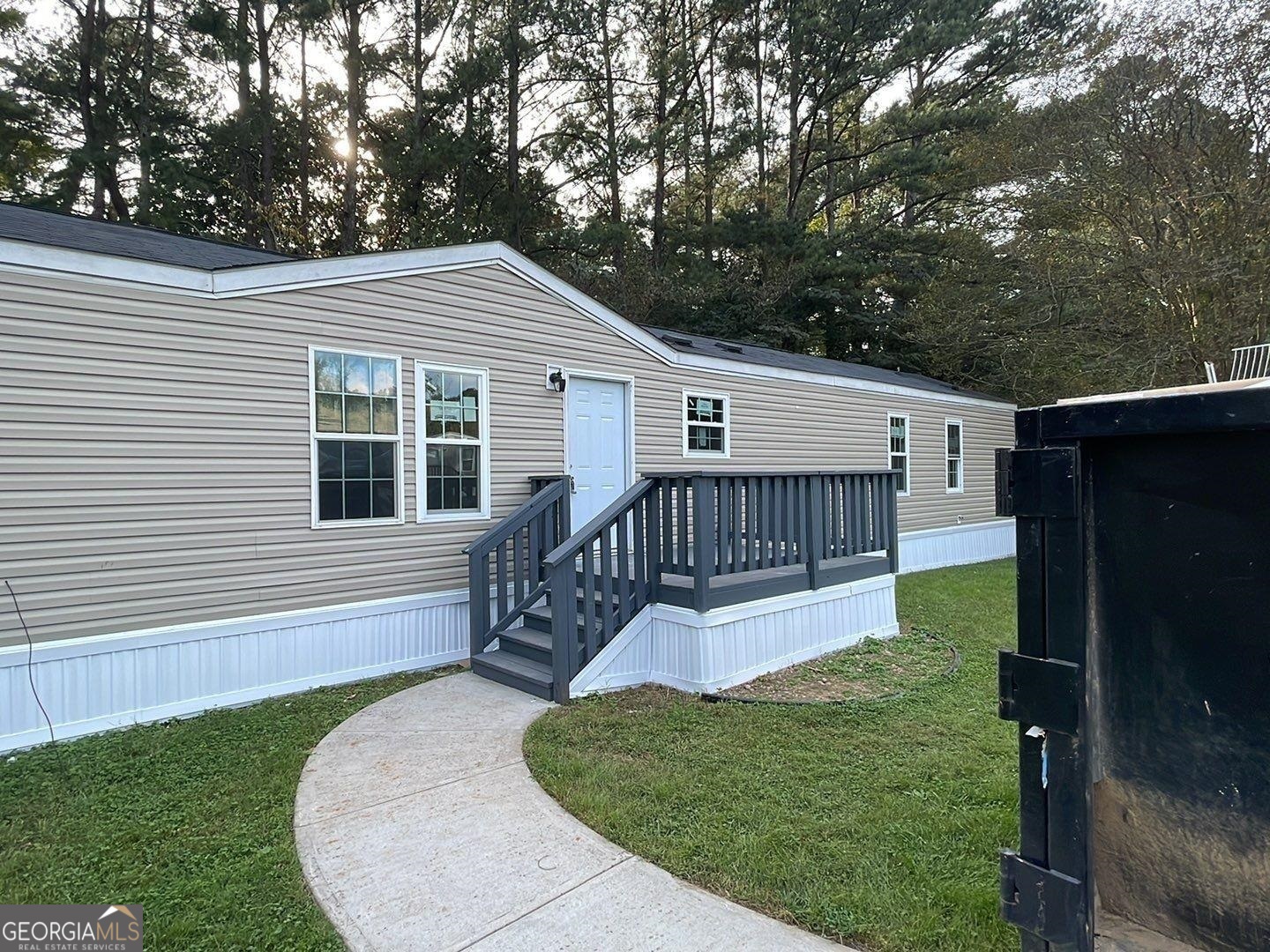 a view of a house with a back yard