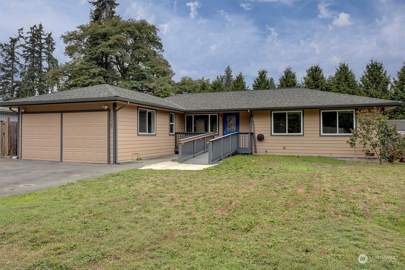 a front view of house with yard and green space