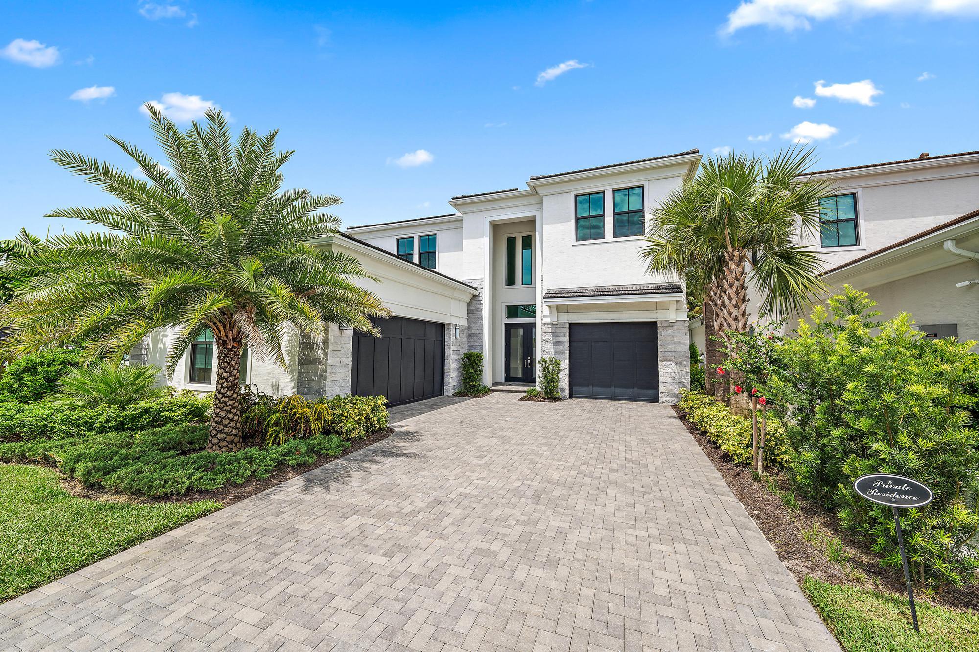 a house with palm tree in front of it