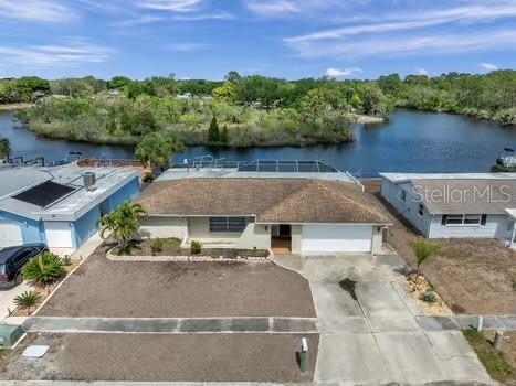 an aerial view of a house with a lake view