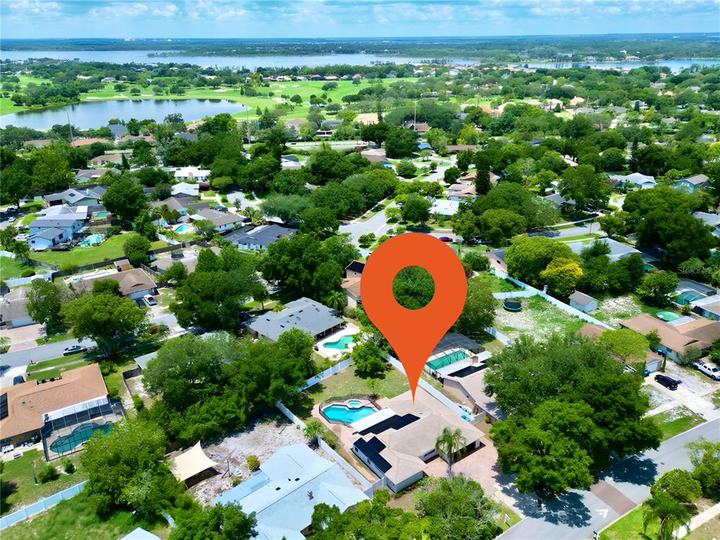 an aerial view of residential house with swimming pool and outdoor space