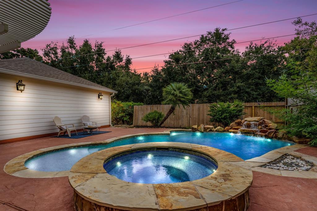 a view of swimming pool having outdoor seating