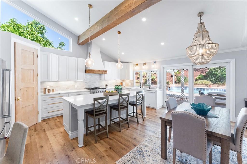 a view of kitchen with dining table and chairs