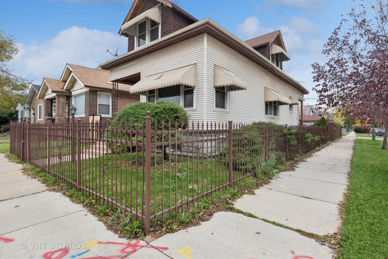 a front view of a house with garden