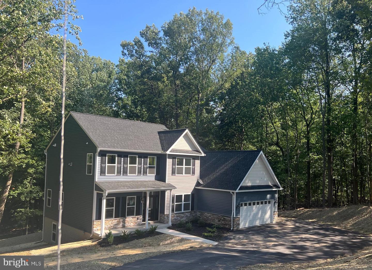 a view of house with yard