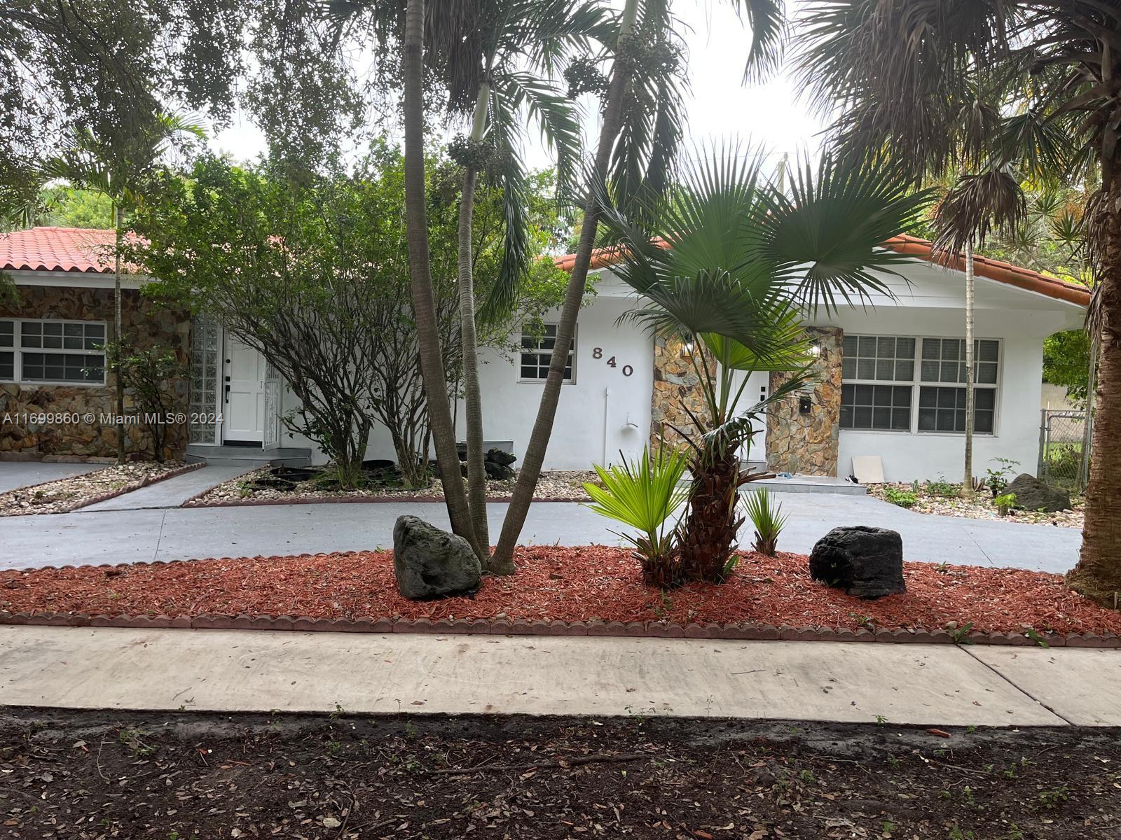 a view of a house and a yard