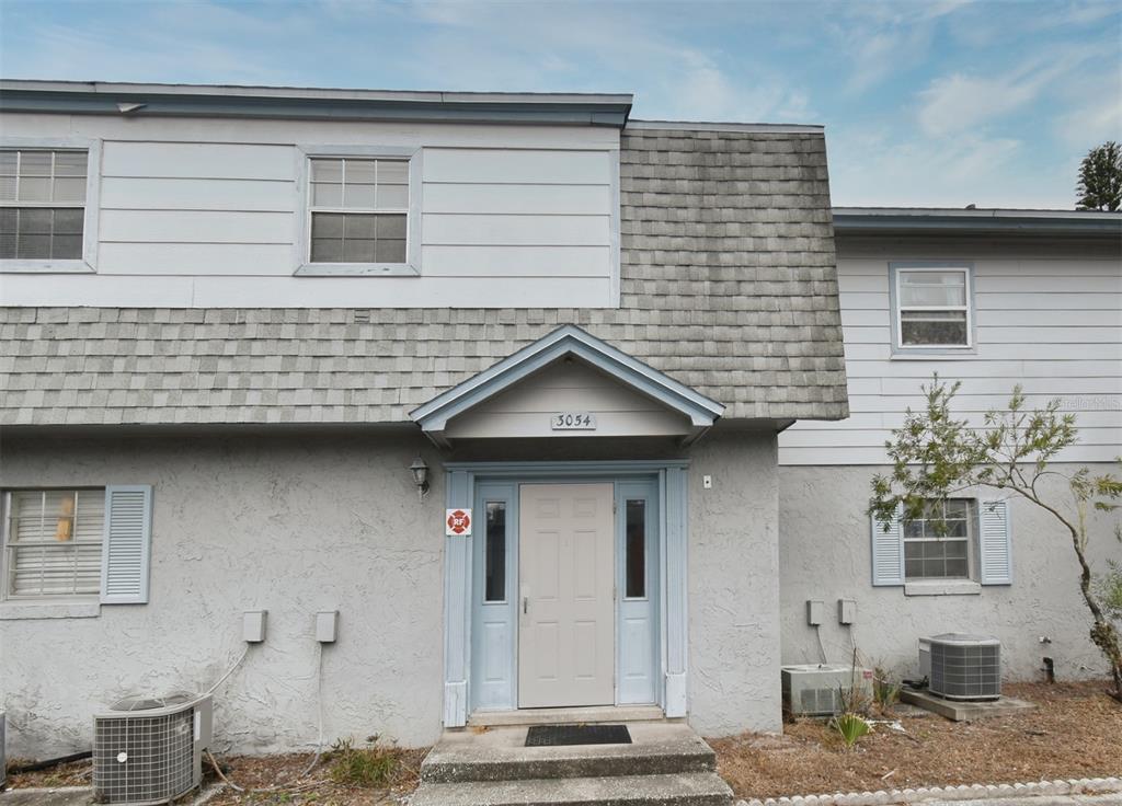 a front view of a house with garage