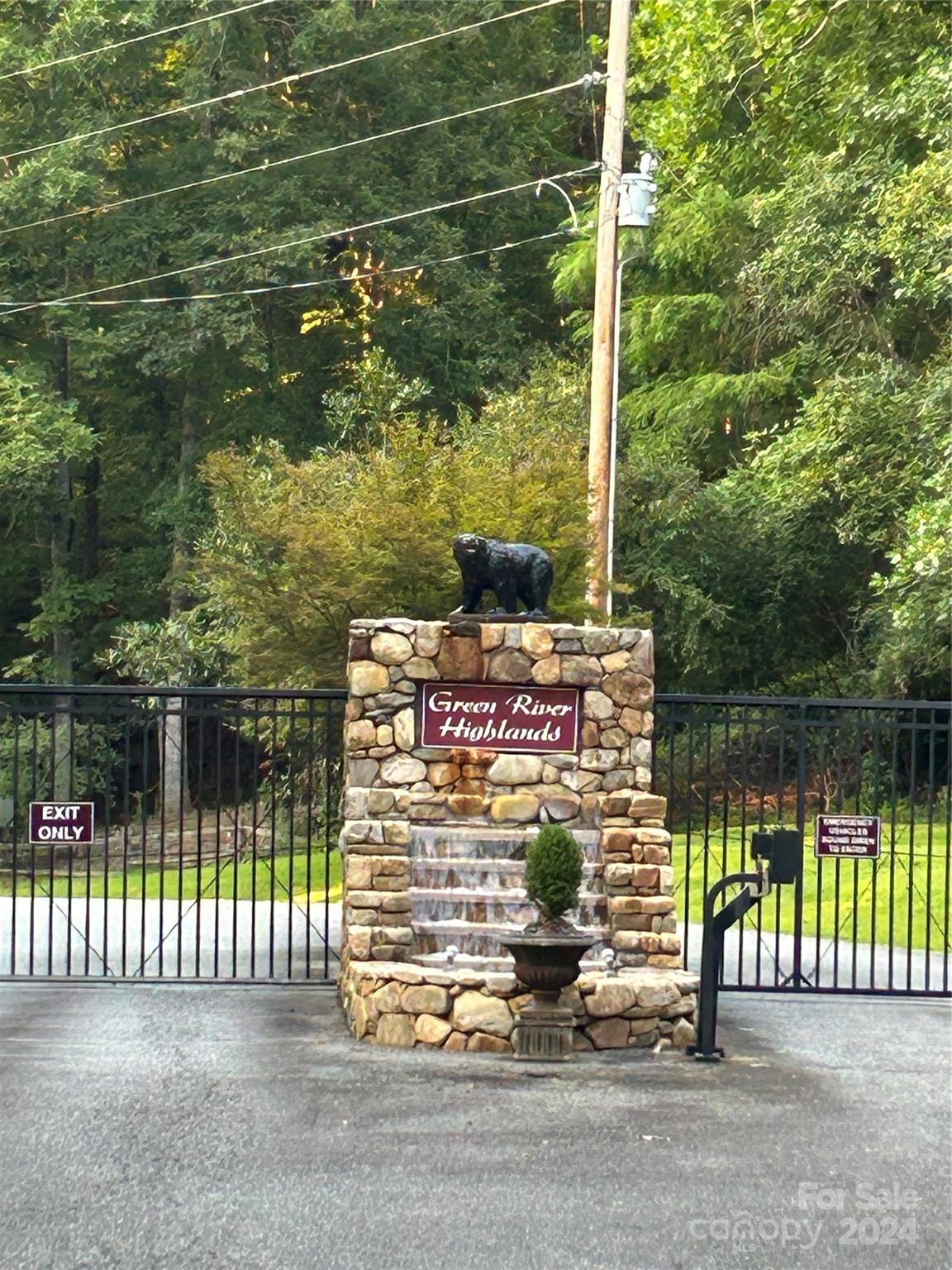 a sign on the side of a lake