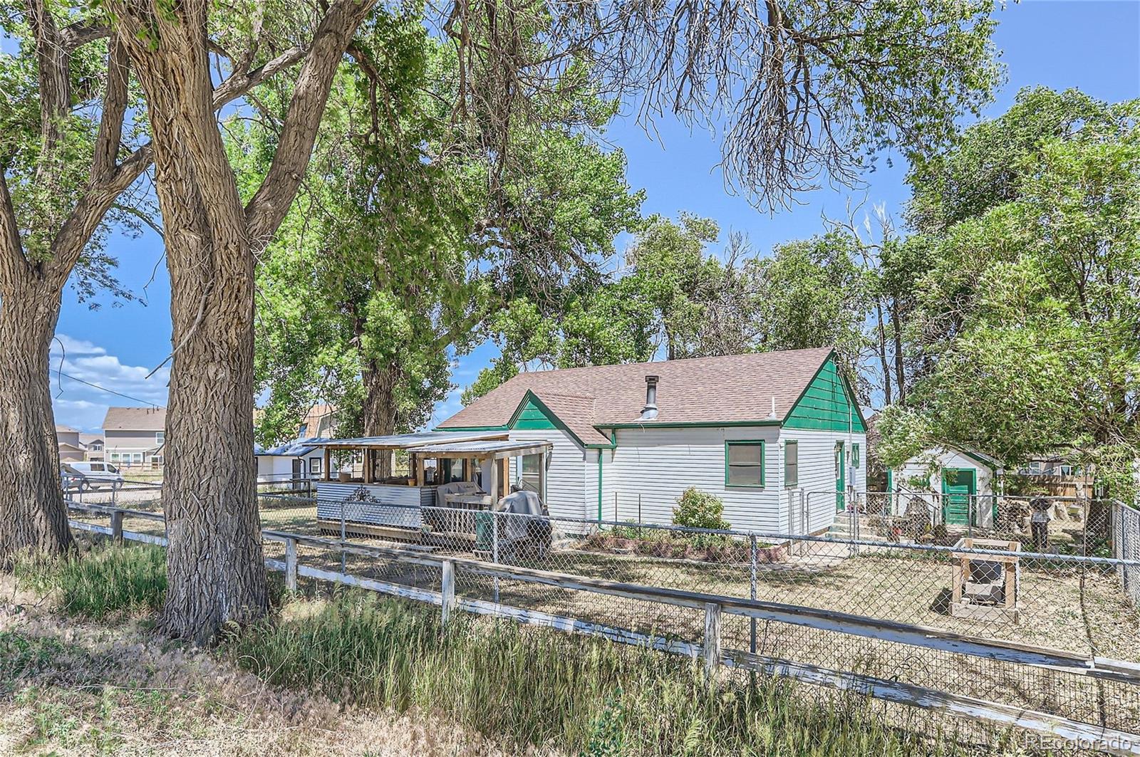 a view of house with trees in the background