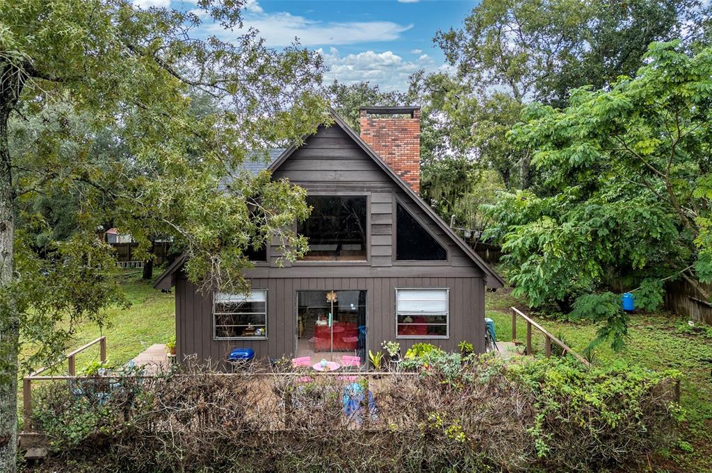 a view of front of house with a small yard