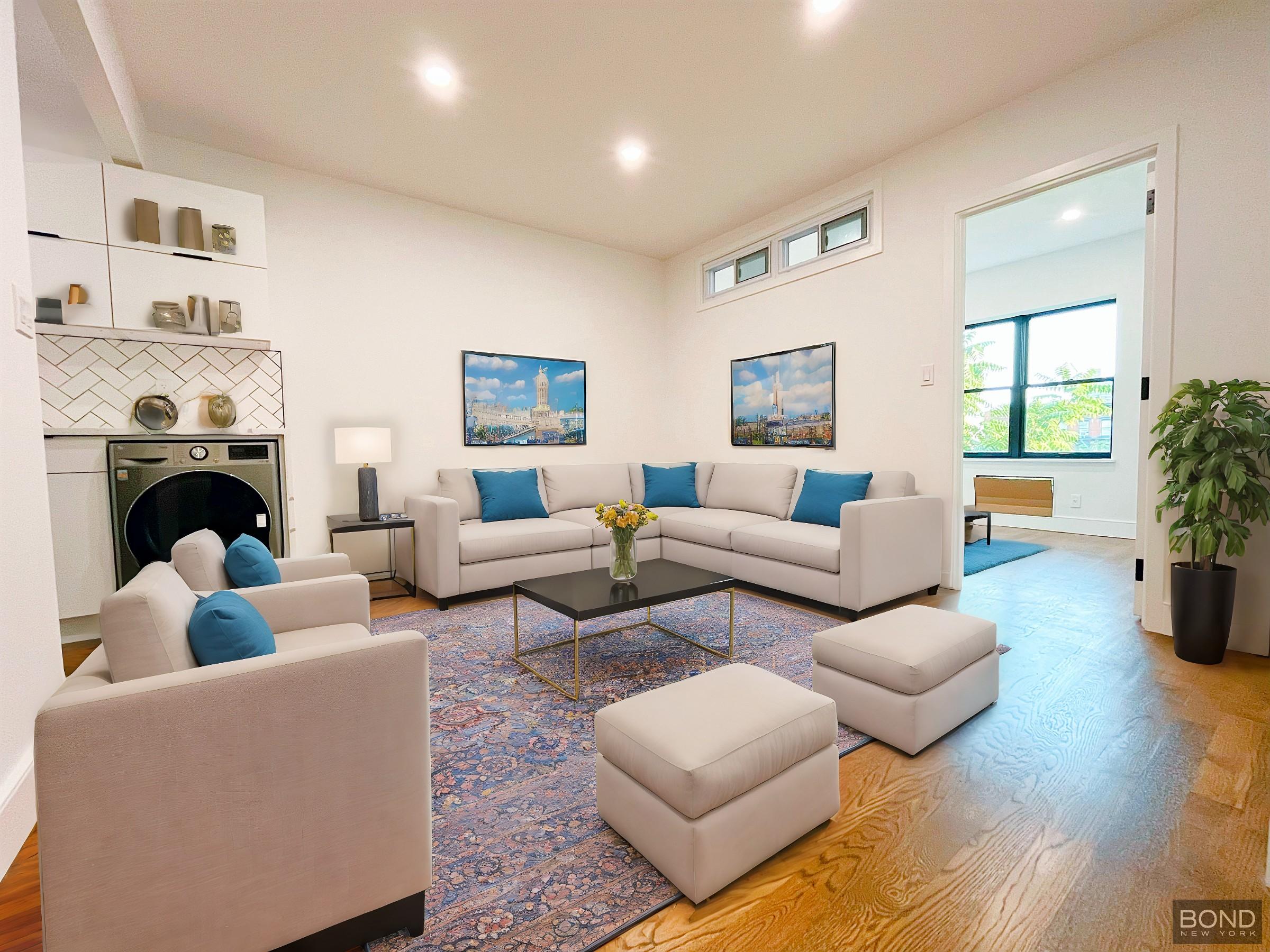 a living room with furniture and a fireplace