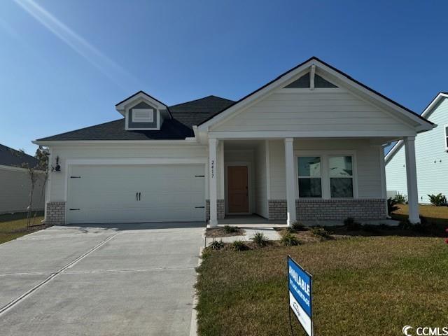 View of front of house with covered porch, a front