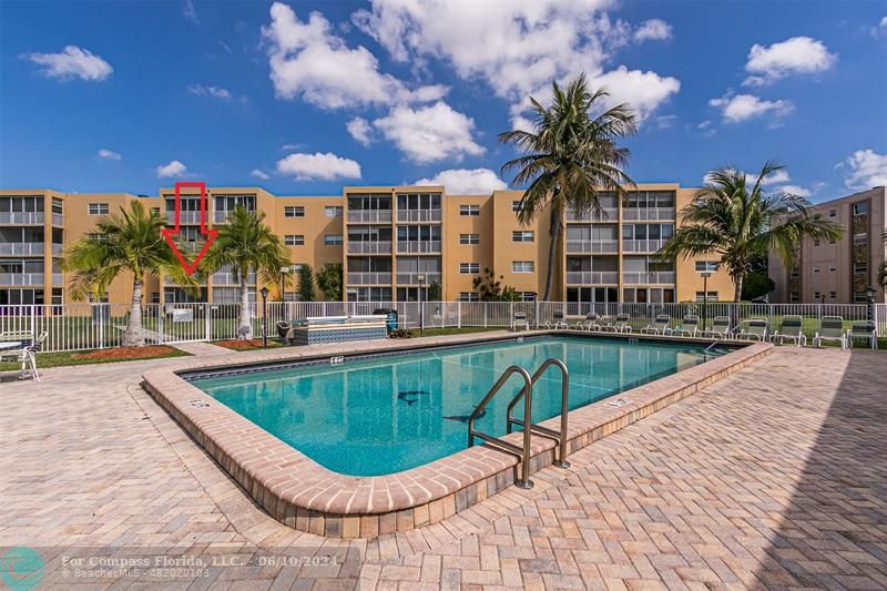 a view of a swimming pool with a patio