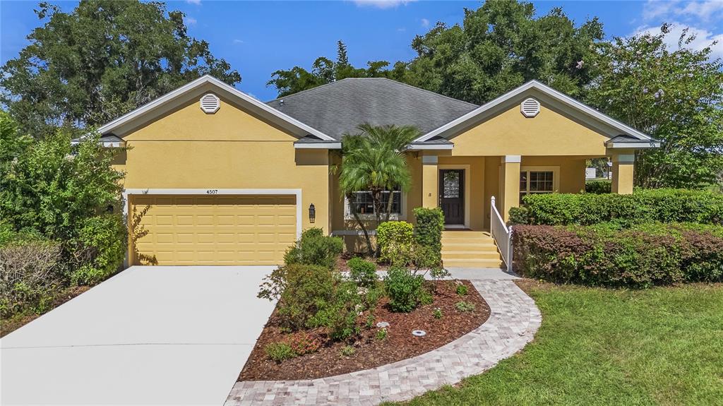 Welcome to this custom built home in the OLA BEACH community with a beautiful paver walk way to lead you and your guests through the lush landscaped yard and flower garden.