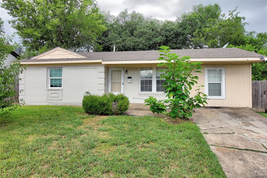 a view of a house with yard and a garden