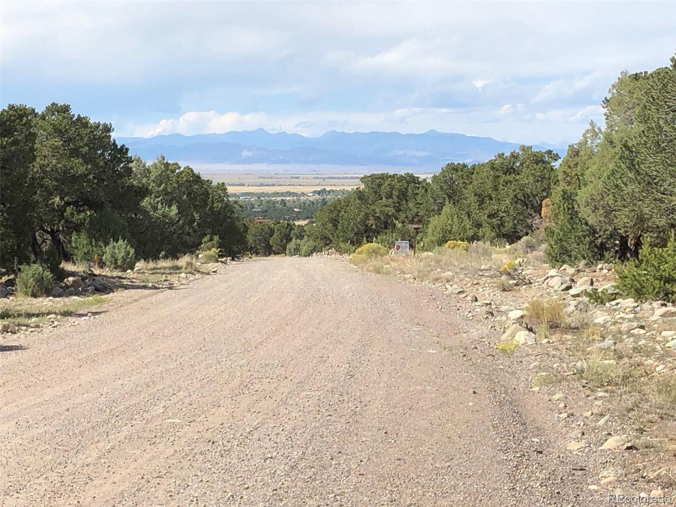 a view of a road with a building in the background