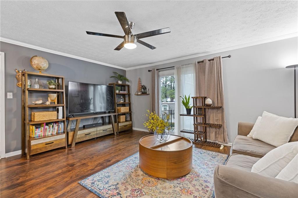 a living room with furniture and a flat screen tv