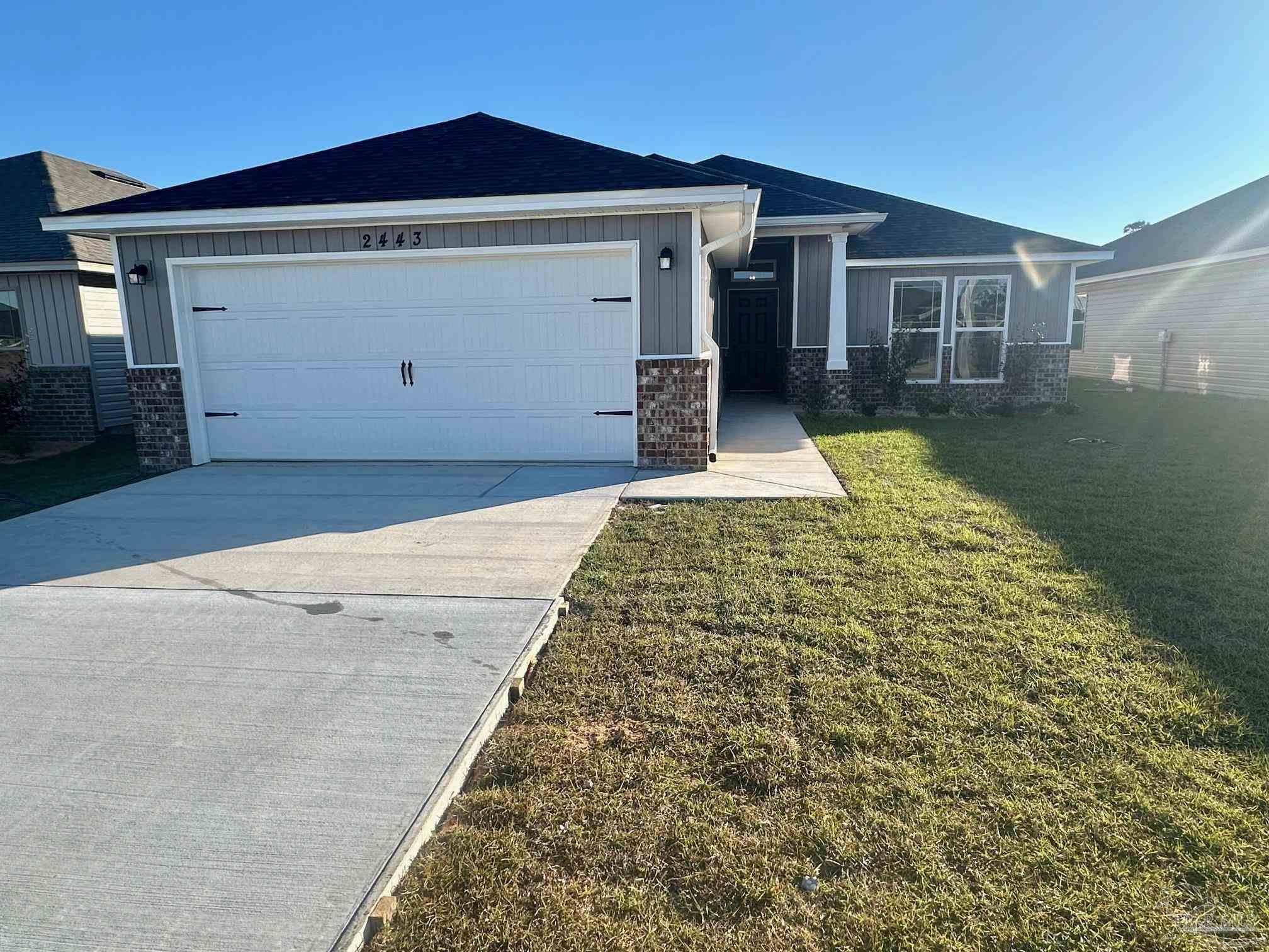 front view of a house with a yard